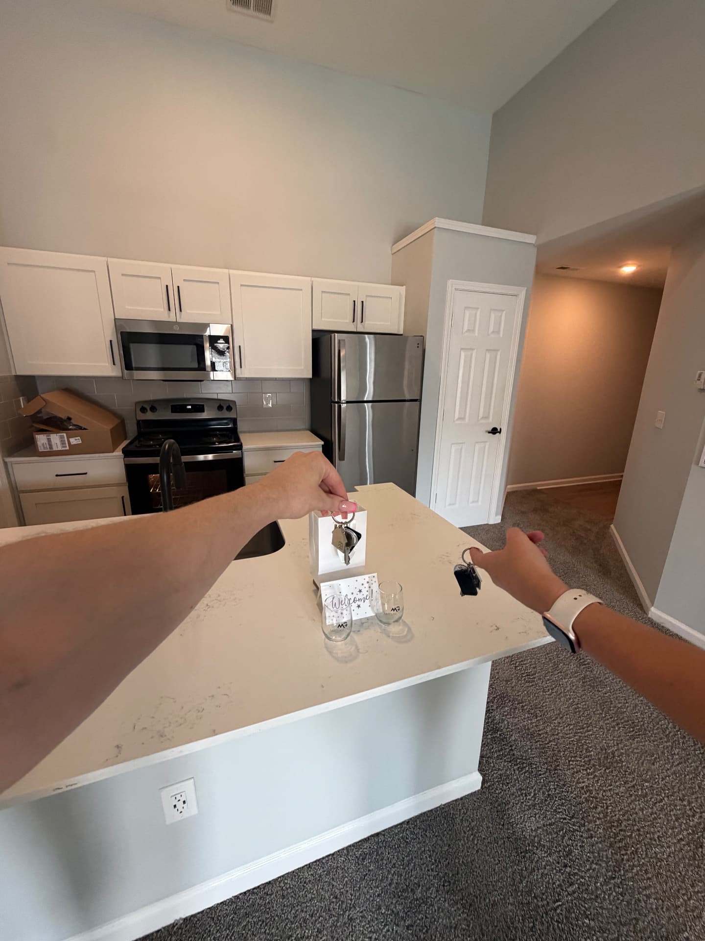 Joseph picking up the keys to his new apartment